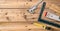 Carpentry. Measure tape, spirit level and rulers on wooden background, copy space, top view
