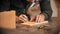 Carpentry working - bearded man making marks on the wood