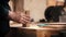 Carpentry working - man holding flat pieces of wooden details in the workshop