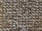 Carpet fibres close-up. Beige abstract background.