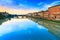 Carraia medieval Bridge on Arno river, sunset landscape. Florenc