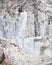 Carrara white marble quarry and an excavator. Tuscany. Italy