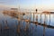 Carrasqueira Palafitic Pier in Comporta, Portugal at sunset.