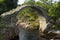 CARRBRIDGE, BADENOCH and STRATHSPEY/SCOTLAND - AUGUST 28 : Packhorse bridge at Carrbridge Scotland on August 28, 2015