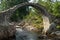 CARRBRIDGE, BADENOCH and STRATHSPEY/SCOTLAND - AUGUST 28 : Packhorse bridge at Carrbridge Scotland on August 28, 2015