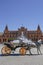 Carriage driver taking pciture to their costumers in front of Plaza de Espana Fountain, Seville, Spain