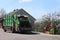 Carriage of garbage by the municipal service. Two janitors load garbage into the garbage truck. Ecology and cleanliness of the cit