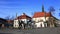 Carriage of horses passes City Hall Square in Krakow