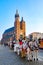 Carriages for riding tourists on the background of Mariacki cathedral