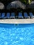 Carribean resort with poolside chairs