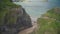 Carrick-a-Rede aerial view: Irish rope bridge in front of seascape. Picturesque landmark