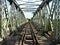 Carriers cross bridge along abandoned railroad, Katanga, Congo