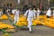 Carriers walking with cheeses in the Dutch cheese market