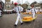 Carriers walking with many cheeses in the famous Dutch cheese market in Alkmaar,