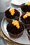 Carrot cupcakes with chocolate crumbs and frosting