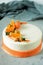 Carrot dessert on a plate. High kitchen. Carrot cake with spicy biscuit, carrot tangerine jelly and cheese mousse