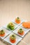 Carrot entrees with guacamole, presentation of catering for celebration. Served on colored tablecloth