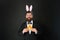 Carrot is always good idea. Easter rabbit black background. Bearded man hold carrots. Happy businessman wear rabbit ears