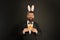 Carrot is always good idea. Easter rabbit black background. Bearded man hold carrots. Happy businessman wear rabbit ears