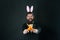 Carrot is always good idea. Rabbit costume party. Bunny or hare. Easter symbol. Holiday celebration. Easter rabbit black