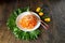 Carrot Korean meat salad with chopsticks on wooden oak table