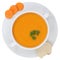 Carrot soup with carrots in bowl from above isolated