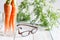 Carrot vitamin A and eyeglasses help your eyes medical concept.