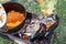 Carrots are cooking in the pot on the fire for rice pilau