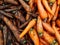 Carrots. Half of the carrots are pure, half carrots are groa. Food. Vegetables. Textured background from fresh large orange