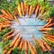 Carrots with Tops Lies Wooden Blue Background