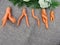 Carrots are an unusual shape on the linen cloth