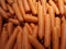 Carrots vegetable orange color are stacked on the basket for sale in the market