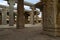 Carrved pillars, maha-mandapa. Achyuta Raya temple, Hampi, Karnataka. Sacred Center. View from the east. A figure of Hanumana is c