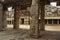 Carrved pillars, maha-mandapa. Achyuta Raya temple, Hampi, Karnataka.View from the east. Sacred Center. The west Gopura is also se