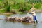 Carrying sugarcane by a bamboo raft