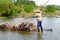 Carrying sugarcane by a bamboo raft