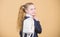 Carrying things in backpack. Schoolgirl ponytails hairstyle with small backpack. Learn how fit backpack correctly. Girl