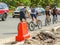 Cars and bicycles on a paved road.