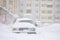 Cars blocked by snow, snow-paralysis of traffic, snow covered street, blizzard, front view, winter weather, work for utility compa