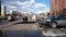 Cars, buildings, people walking near the Yasenevo metro station in Moscow