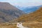 Cars on Cardrona Pass with view towards Queenstown