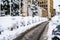 Cars covered with snow from the first snow fall of the year. Winter concept, snowy cars parked on the street, deep layer of snow