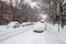 Cars covered in snow during snowstorm