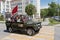 Cars decorated with flags driving around city streets in celebration of the victory day