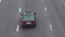 Cars drive along the asphalt highway, top view. Passenger traffic, background, copy space for text, highway