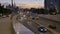 Cars drive along street to tunnel traffic interchange