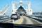 Cars on the drive up to a big ferry boat in the port for a journey over the Baltic Sea