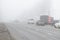 Cars drives in dense fog