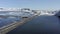 Cars Driving Along a Narrow Road Crossing a Lake in Iceland