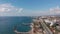 Cars driving by coastal road with incredible view of Alanya Bay, Turkey. Lagoon with blue sea water, rocks and busy highway road.